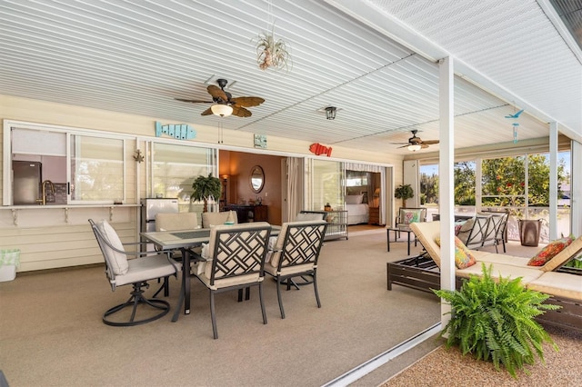 view of patio with ceiling fan, an outdoor living space, and outdoor dining space