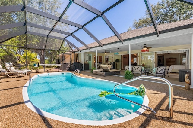 outdoor pool featuring an outdoor living space, glass enclosure, ceiling fan, and a patio area