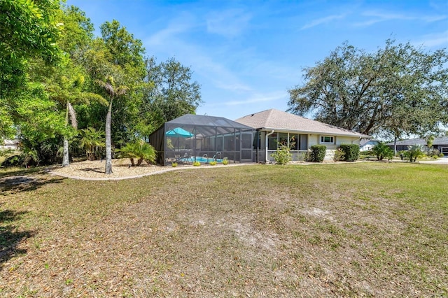 view of yard featuring glass enclosure