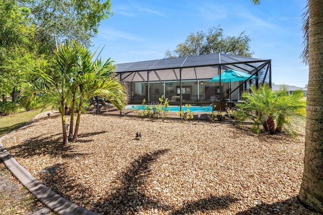 view of yard with a lanai and an outdoor pool