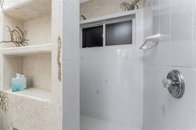 full bath featuring a tile shower