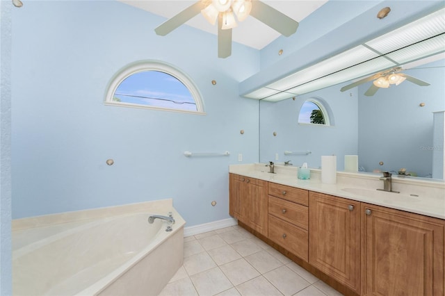 bathroom featuring a bath, double vanity, a sink, and tile patterned floors