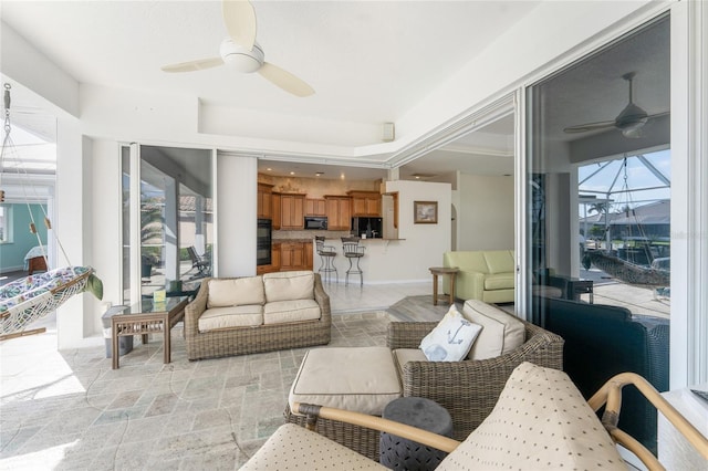 sunroom with a ceiling fan