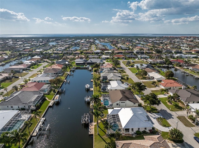 aerial view featuring a water view and a residential view