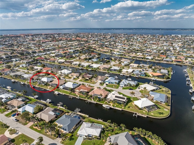 aerial view with a residential view and a water view