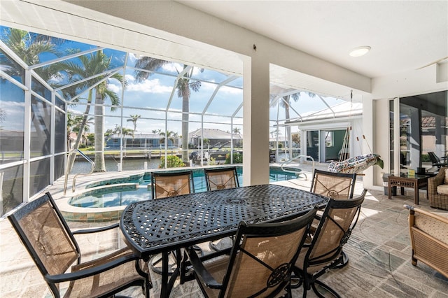 sunroom / solarium with a water view and a pool