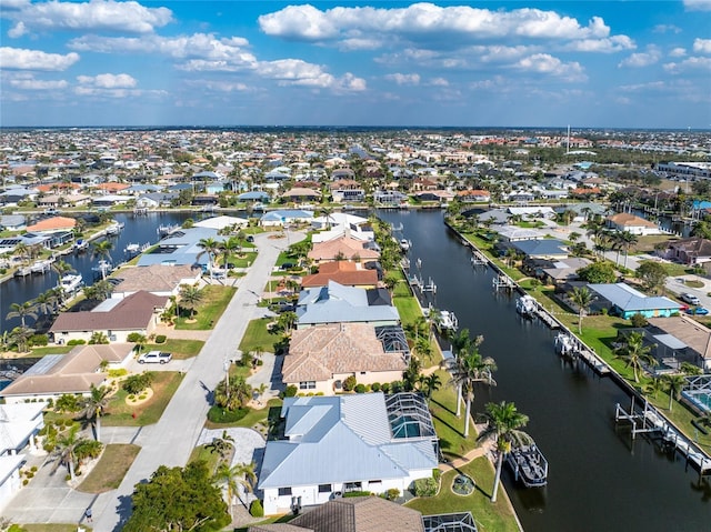 bird's eye view featuring a residential view and a water view