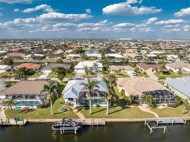 bird's eye view with a water view and a residential view