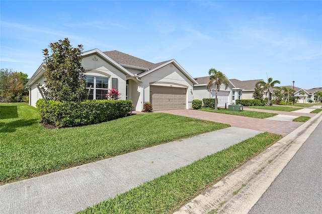 single story home with a garage, a front lawn, decorative driveway, and stucco siding