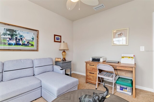 office with light colored carpet, visible vents, ceiling fan, and baseboards