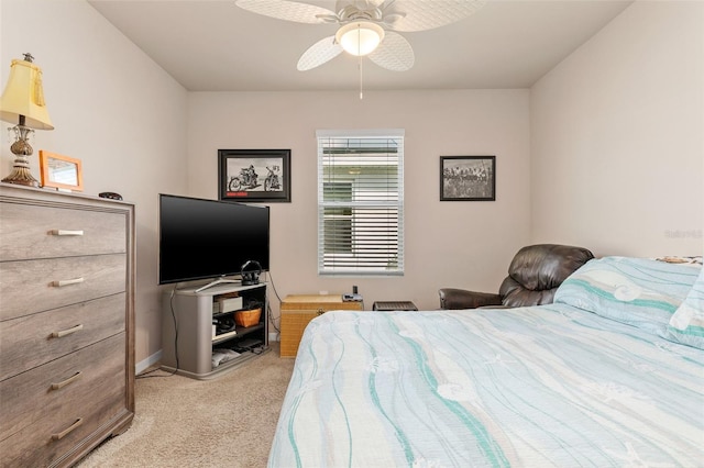 bedroom with baseboards, a ceiling fan, and light colored carpet