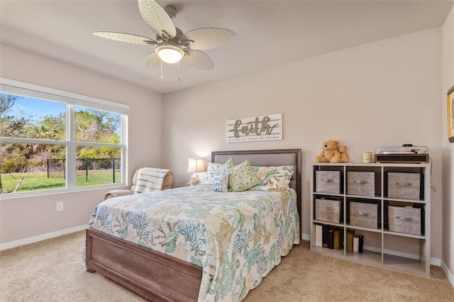 bedroom featuring carpet floors, baseboards, and a ceiling fan