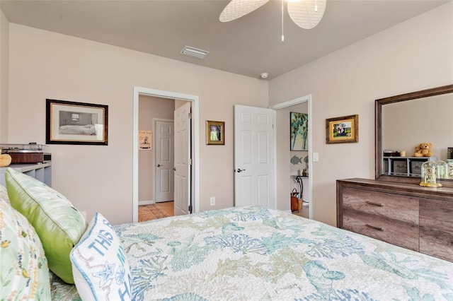 bedroom with ceiling fan and visible vents