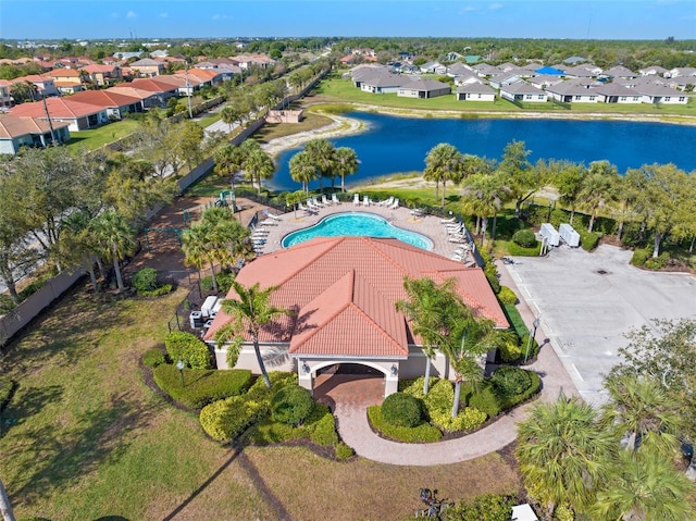 birds eye view of property featuring a water view and a residential view