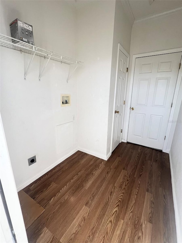 laundry room featuring washer hookup, dark wood finished floors, electric dryer hookup, laundry area, and baseboards