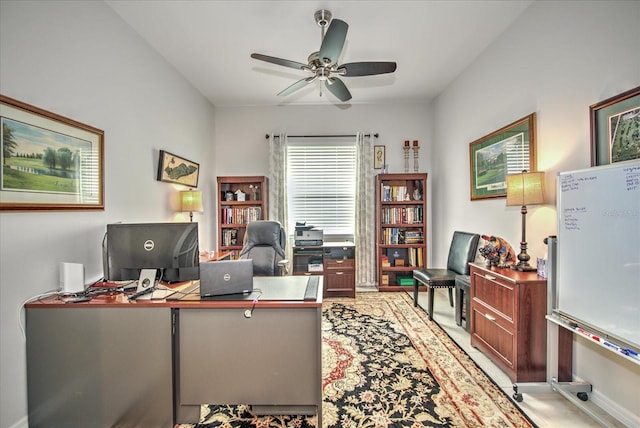 office with ceiling fan and baseboards