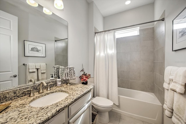 bathroom with toilet, vanity, shower / bath combo with shower curtain, and tile patterned floors