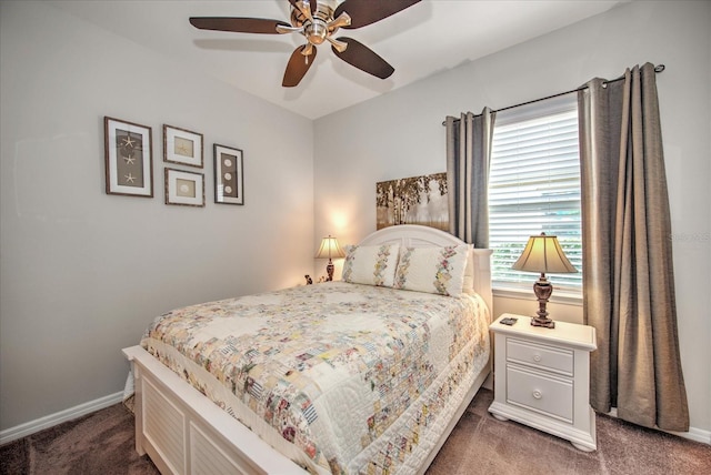 carpeted bedroom featuring ceiling fan and baseboards