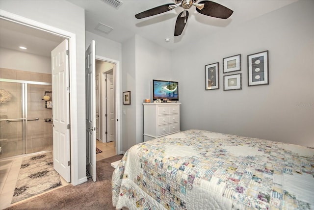 bedroom with visible vents, connected bathroom, a ceiling fan, tile patterned floors, and carpet floors