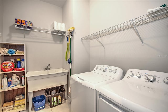 laundry room with laundry area and washing machine and clothes dryer