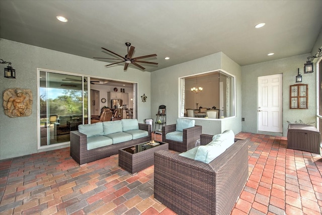 view of patio / terrace with ceiling fan and an outdoor living space