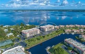 birds eye view of property featuring a water view