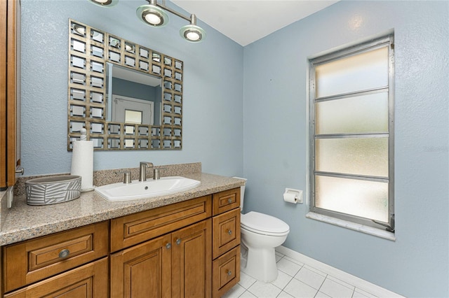 16571 Cape Horn Blvd, Punta Gorda, FL 33955 - bathroom featuring tile patterned flooring, toilet, vanity, and baseboards