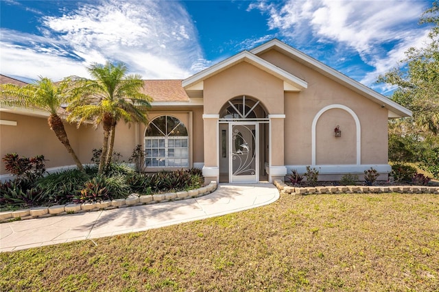 16571 Cape Horn Blvd, Punta Gorda, FL 33955 - ranch-style home featuring stucco siding and a front yard