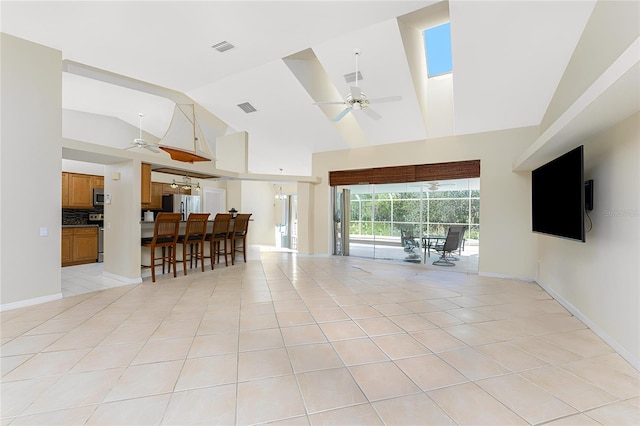 16571 Cape Horn Blvd, Punta Gorda, FL 33955 - living room with visible vents, baseboards, light tile patterned flooring, and a ceiling fan