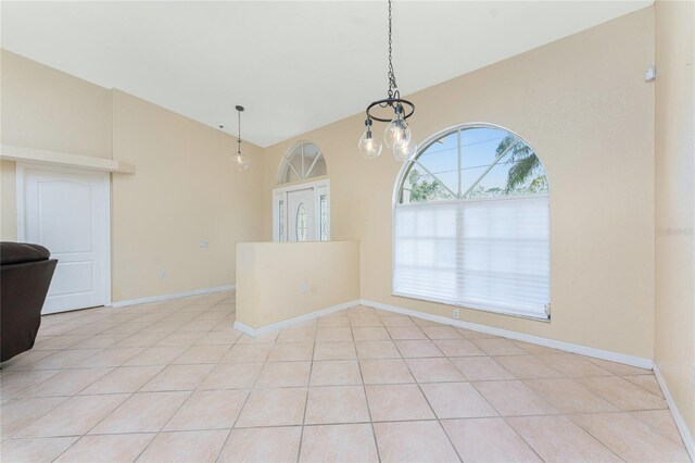 16571 Cape Horn Blvd, Punta Gorda, FL 33955 - interior space featuring light tile patterned floors, baseboards, and lofted ceiling