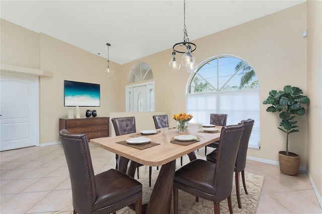 16571 Cape Horn Blvd, Punta Gorda, FL 33955 - dining area with lofted ceiling, light tile patterned flooring, and baseboards