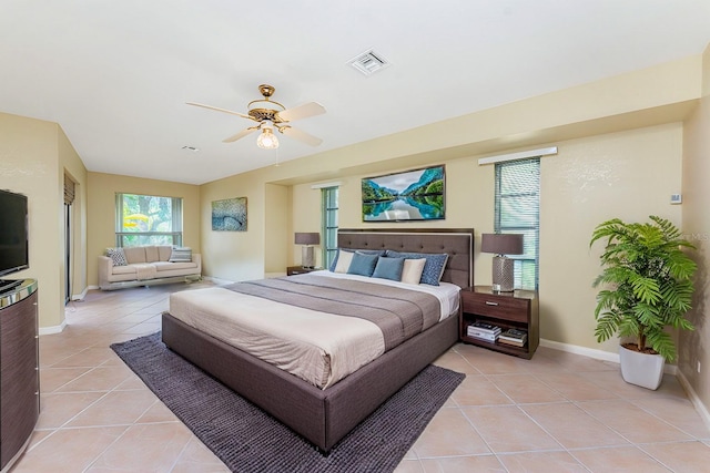 16571 Cape Horn Blvd, Punta Gorda, FL 33955 - bedroom with visible vents, baseboards, light tile patterned flooring, and a ceiling fan