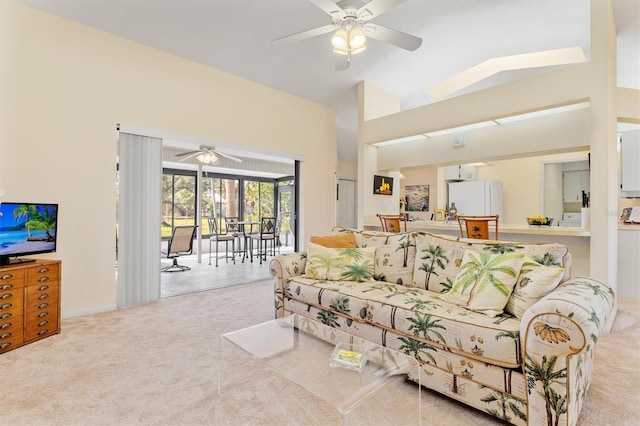 living area featuring high vaulted ceiling, carpet, and ceiling fan