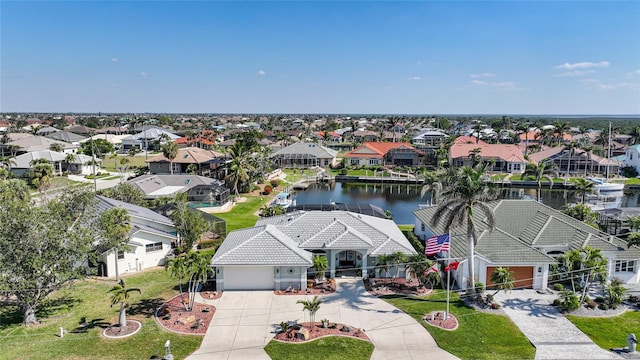 aerial view featuring a water view and a residential view