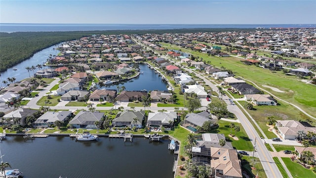 aerial view with a water view and a residential view