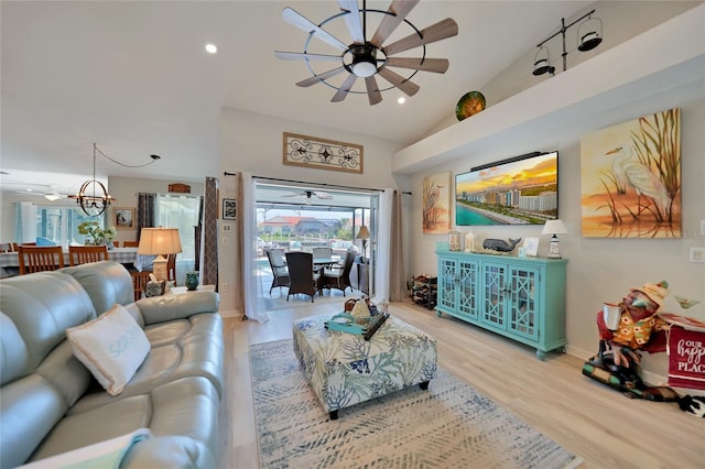 living area featuring recessed lighting, a ceiling fan, baseboards, vaulted ceiling, and light wood finished floors