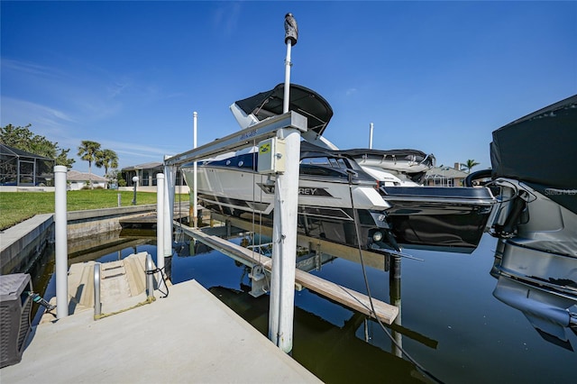 view of dock featuring a water view and boat lift