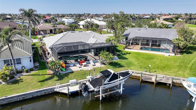 aerial view with a residential view and a water view