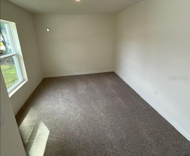 carpeted spare room with baseboards and recessed lighting