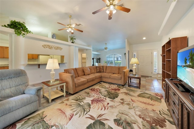 living area featuring lofted ceiling, recessed lighting, and light tile patterned floors