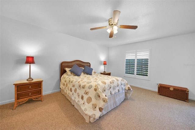 carpeted bedroom featuring ceiling fan and baseboards