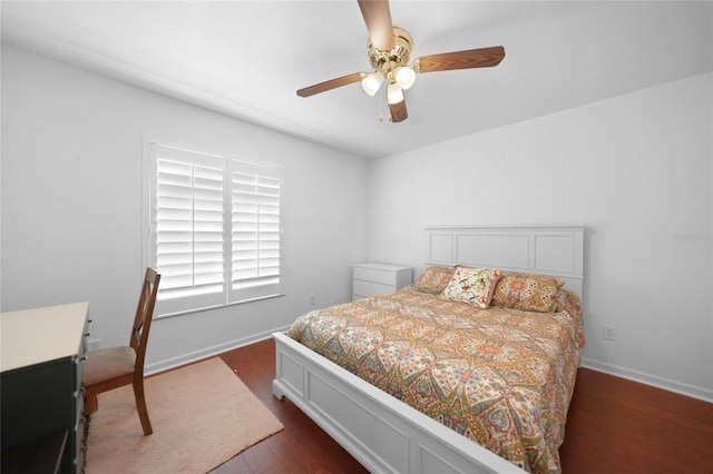 bedroom featuring dark wood finished floors, baseboards, and ceiling fan