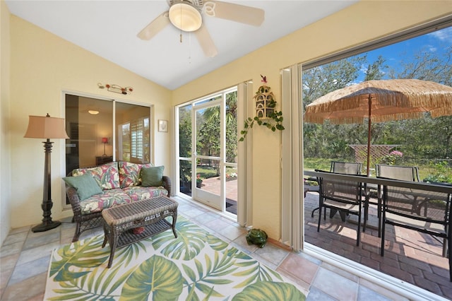 sunroom / solarium with a ceiling fan and lofted ceiling