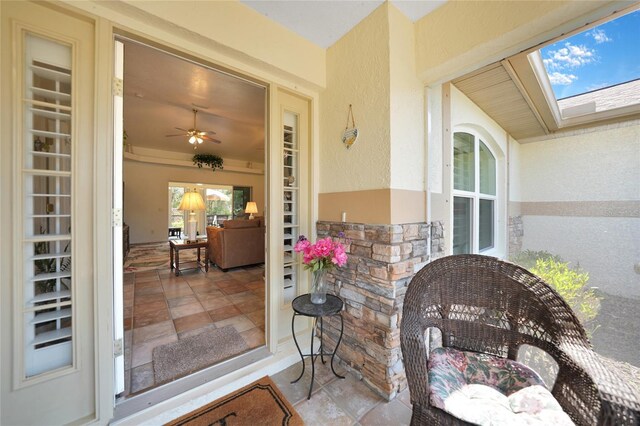 property entrance with stone siding and stucco siding