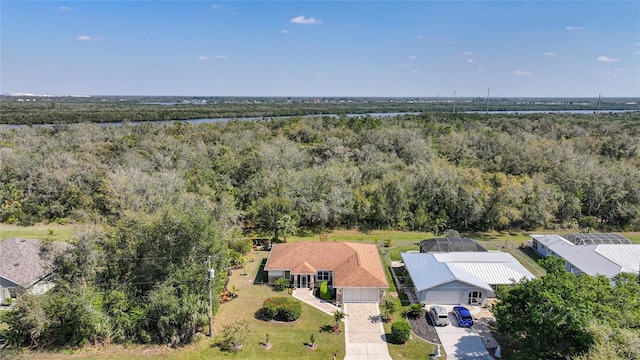 aerial view featuring a wooded view