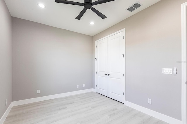 empty room featuring ceiling fan, recessed lighting, visible vents, light wood-style floors, and baseboards