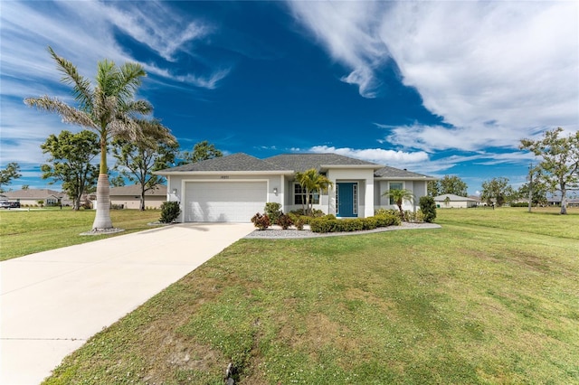 view of front facade with driveway, a front yard, an attached garage, and stucco siding