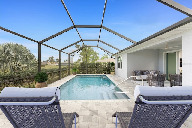 outdoor pool featuring grilling area, an outdoor hangout area, a ceiling fan, glass enclosure, and a patio area