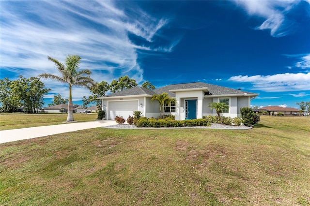 view of front of property with a front yard, driveway, an attached garage, and stucco siding