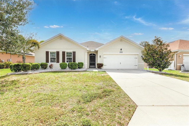 single story home with an attached garage, driveway, a front lawn, and stucco siding